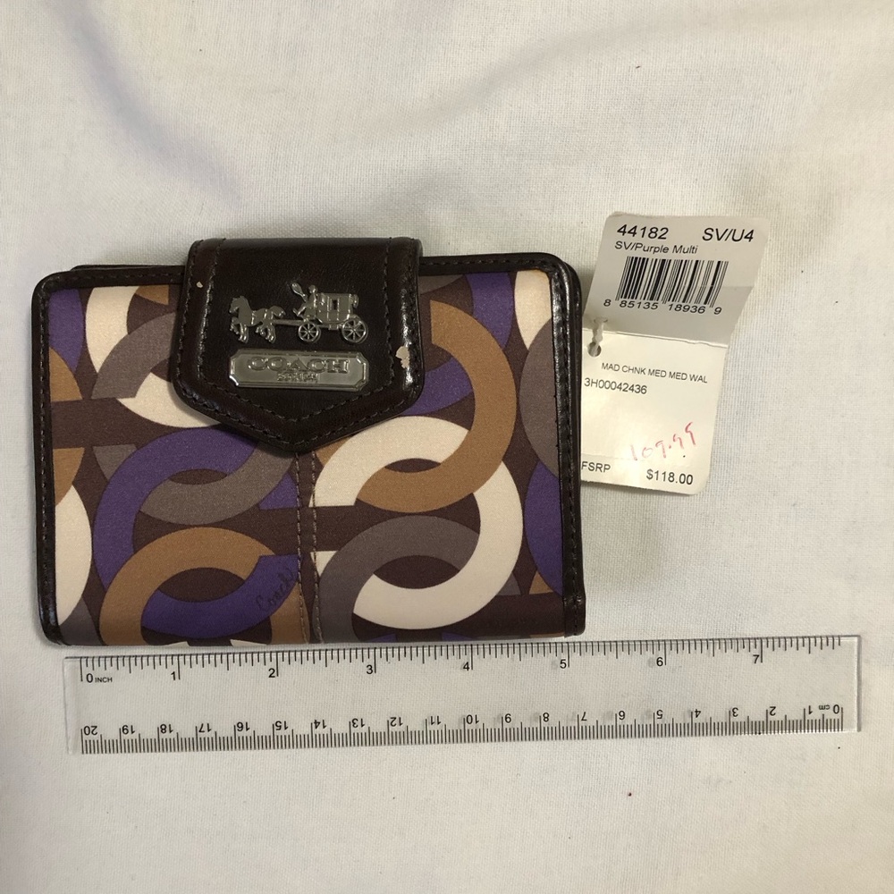 Coach. Women wallet. NWT. slight worn. See pic